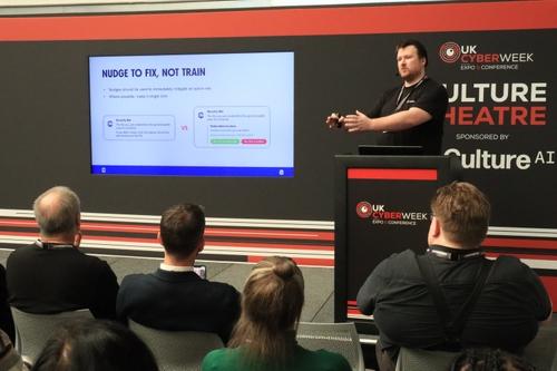 James Speaking on stage at UKCW 2023